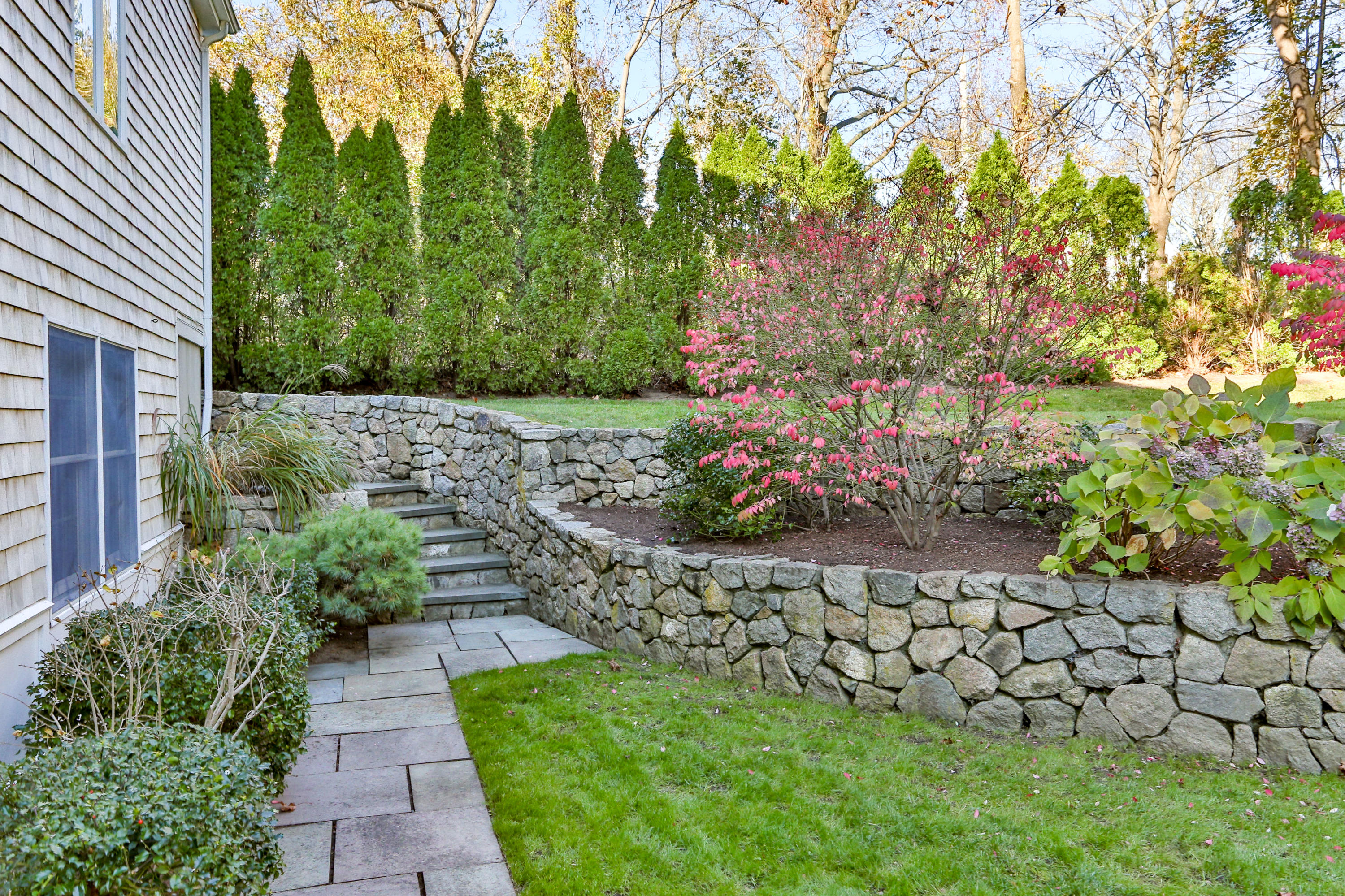 38 Parker Road Osterville, MA 02655 - Photo 53 of 58 a view of a garden with a pathway