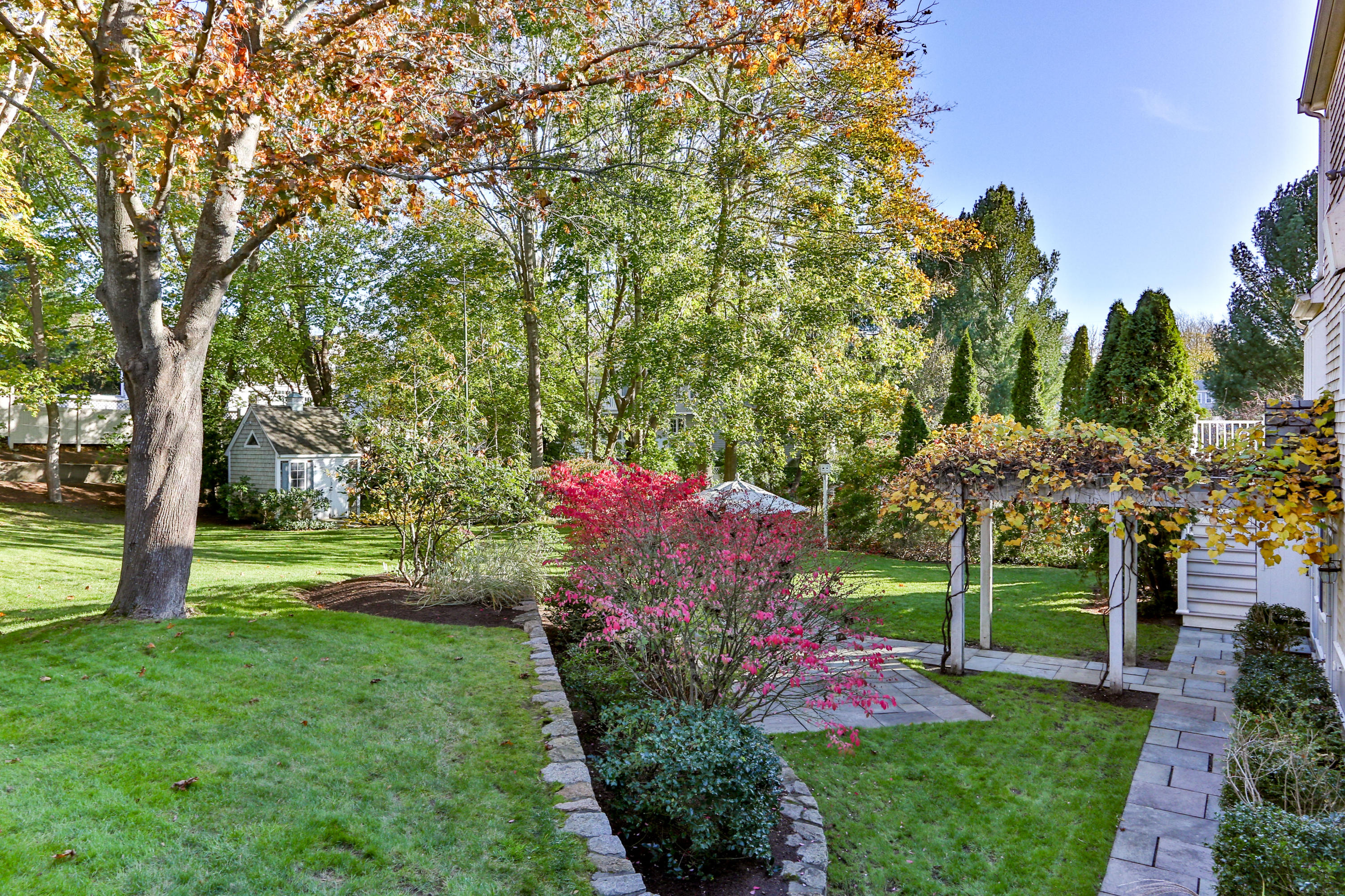 38 Parker Road Osterville, MA 02655 - Photo 54 of 58 a view of a garden with flowers and trees