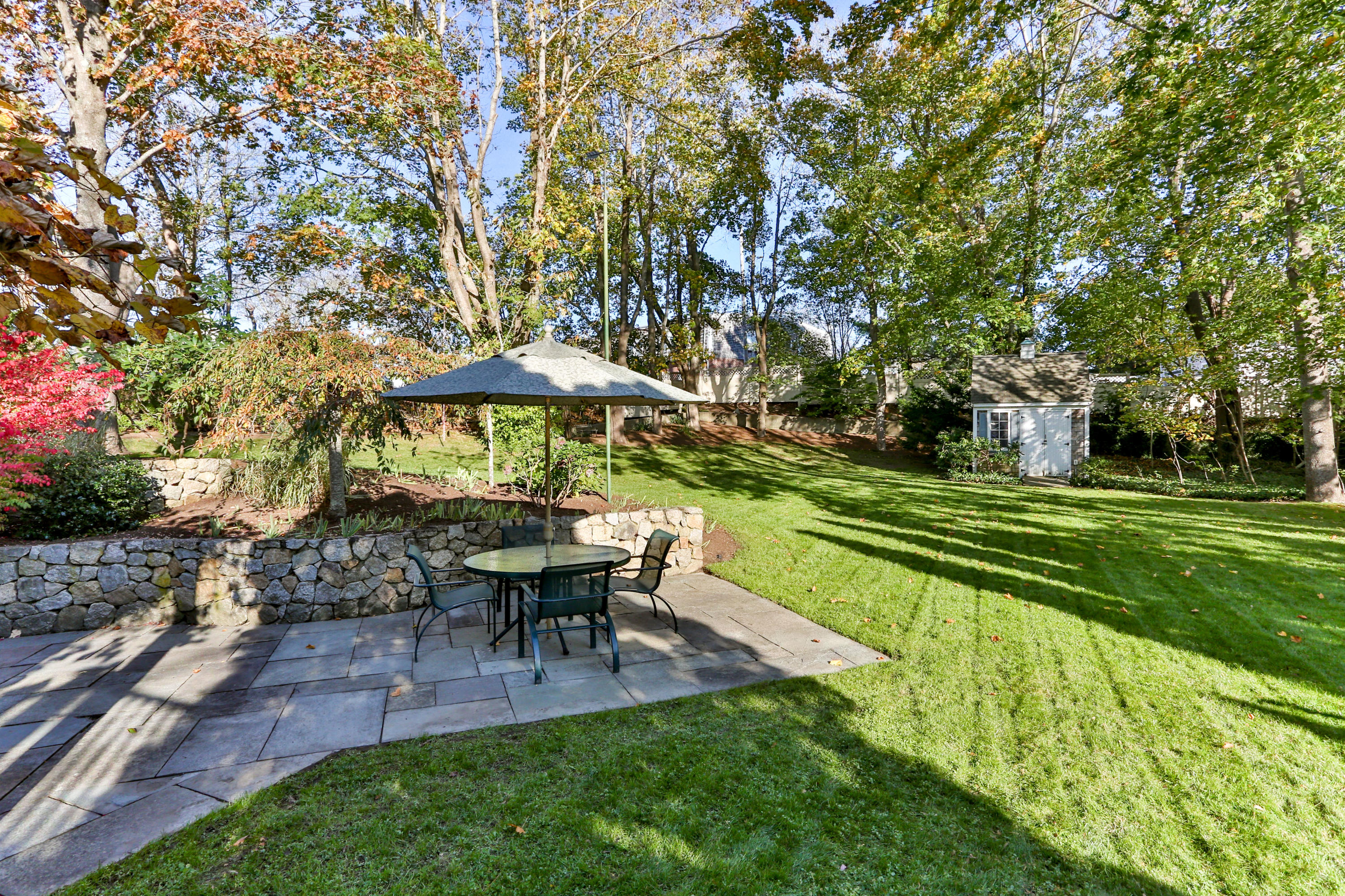 38 Parker Road Osterville, MA 02655 - Photo 55 of 58 a view of a table and chairs under an umbrella