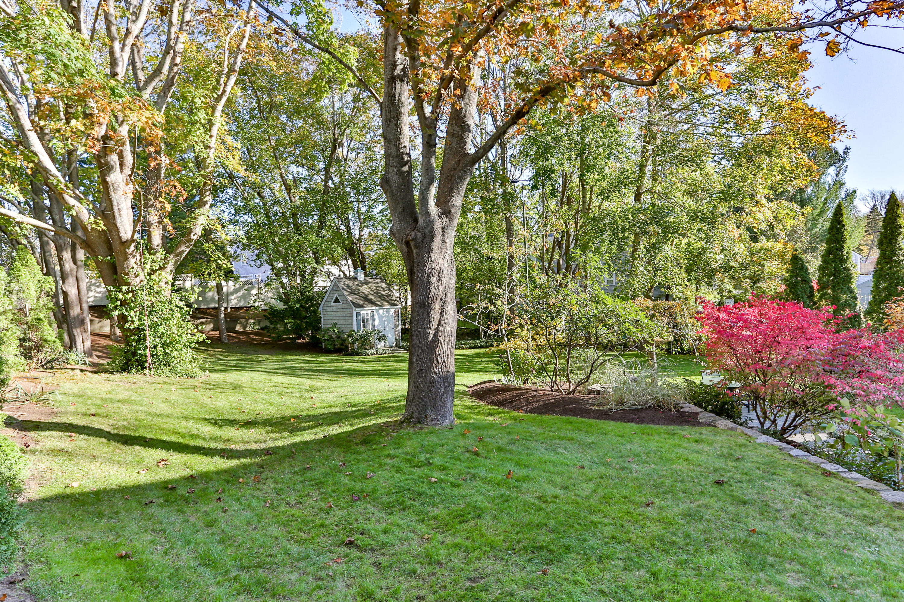 38 Parker Road Osterville, MA 02655 - Photo 57 of 58 a view of a field with flower plants and large trees
