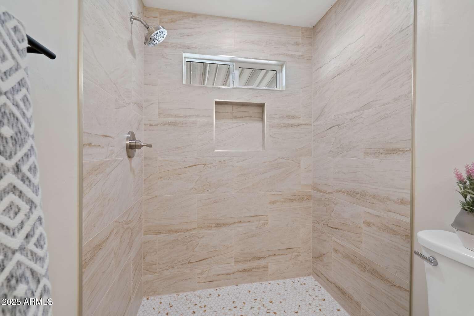 5000 East Grant Road, Unit 203 Tucson, AZ 85712 - Photo 11 of 19 a bathroom with a shower