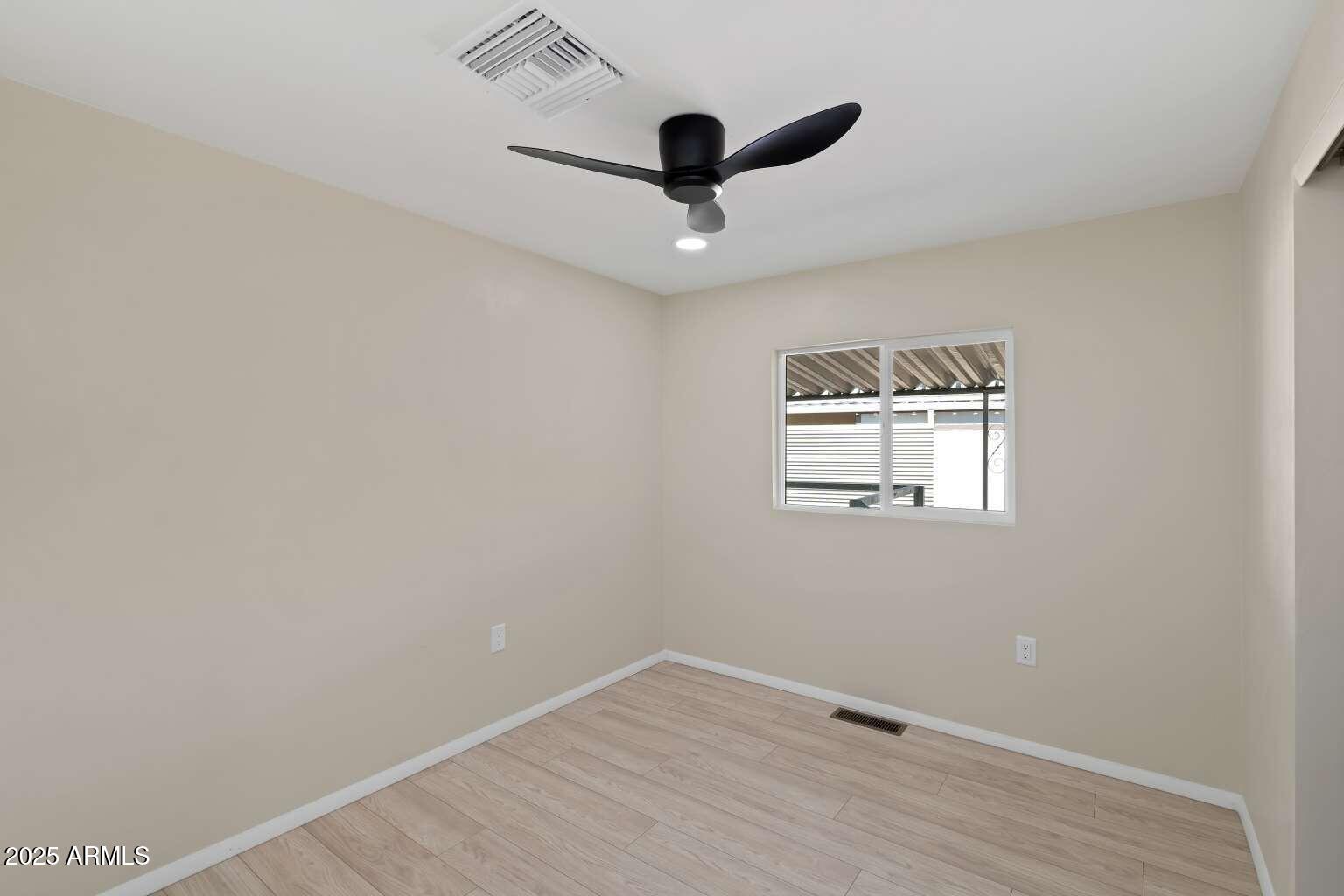 5000 East Grant Road, Unit 203 Tucson, AZ 85712 - Photo 12 of 19 a view of empty room with wooden floor