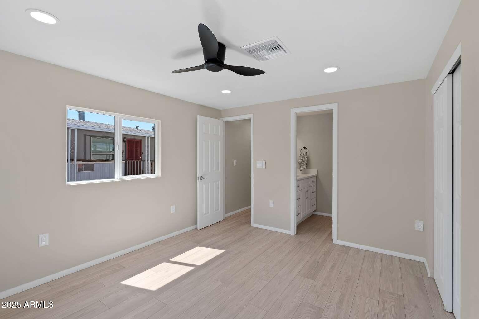 5000 East Grant Road, Unit 203 Tucson, AZ 85712 - Photo 9 of 19 a view of an empty room with a window