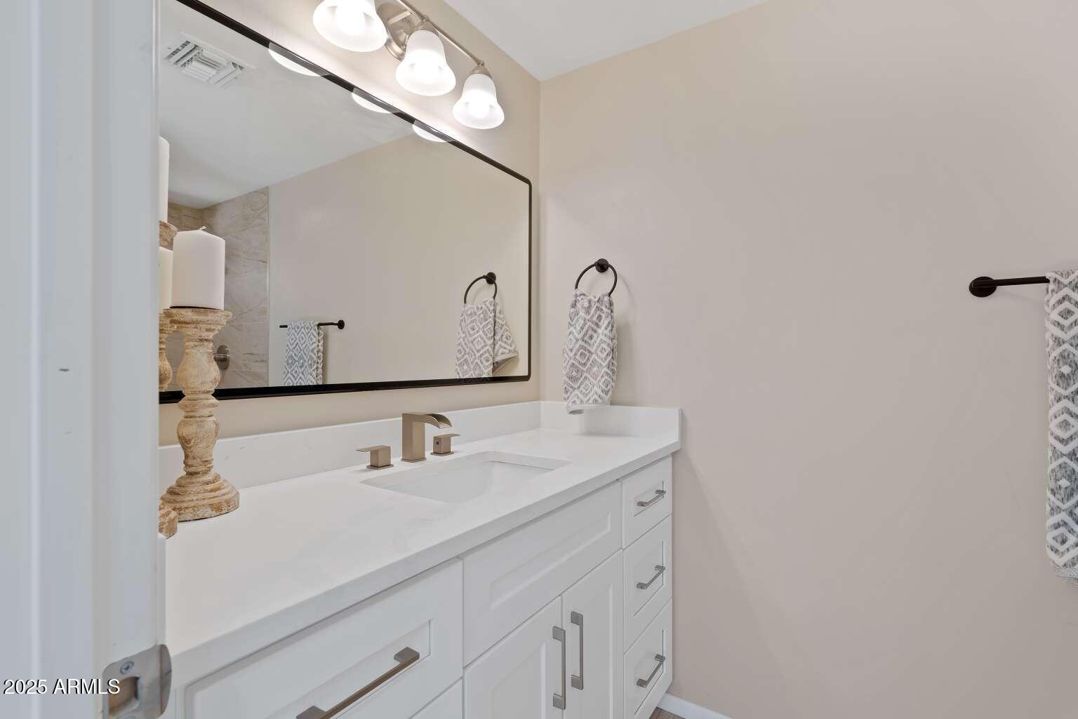 5000 East Grant Road, Unit 203 Tucson, AZ 85712 - Photo 10 of 19 a bathroom with a sink and a mirror