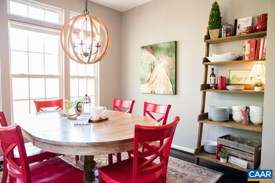 825 Rainier Road Charlottesville, VA 22903 - Photo 13 of 25 a view of a dining room with furniture and chandelier