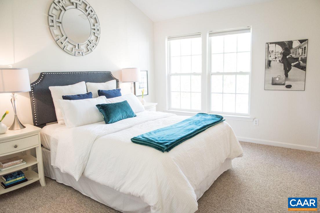 825 Rainier Road Charlottesville, VA 22903 - Photo 16 of 25 a bedroom with a bed and a window