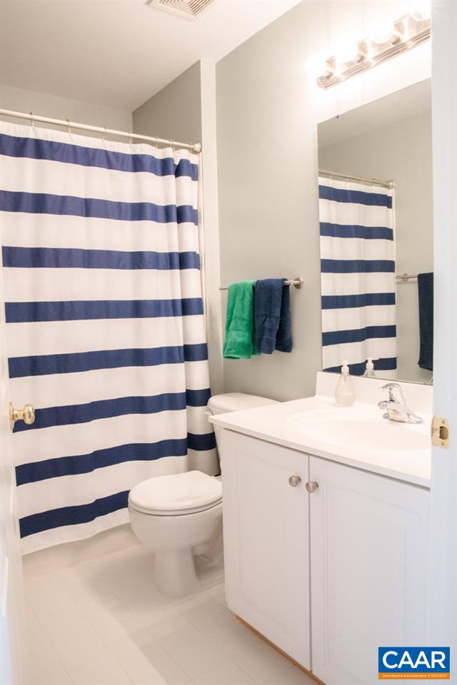825 Rainier Road Charlottesville, VA 22903 - Photo 23 of 25 a bathroom with a sink toilet and shower