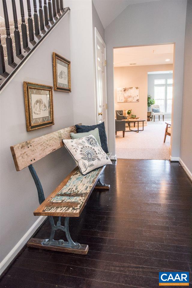 825 Rainier Road Charlottesville, VA 22903 - Photo 4 of 25 a living room with hard wood flooring and a table