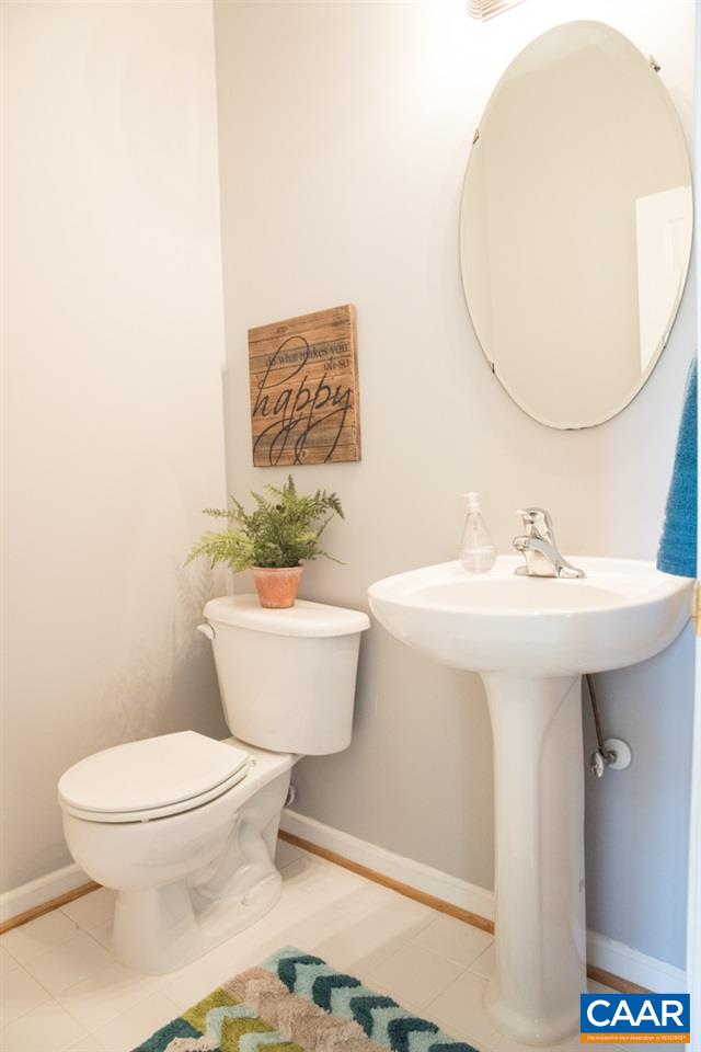 825 Rainier Road Charlottesville, VA 22903 - Photo 6 of 25 a bathroom with a sink a mirror and a toilet