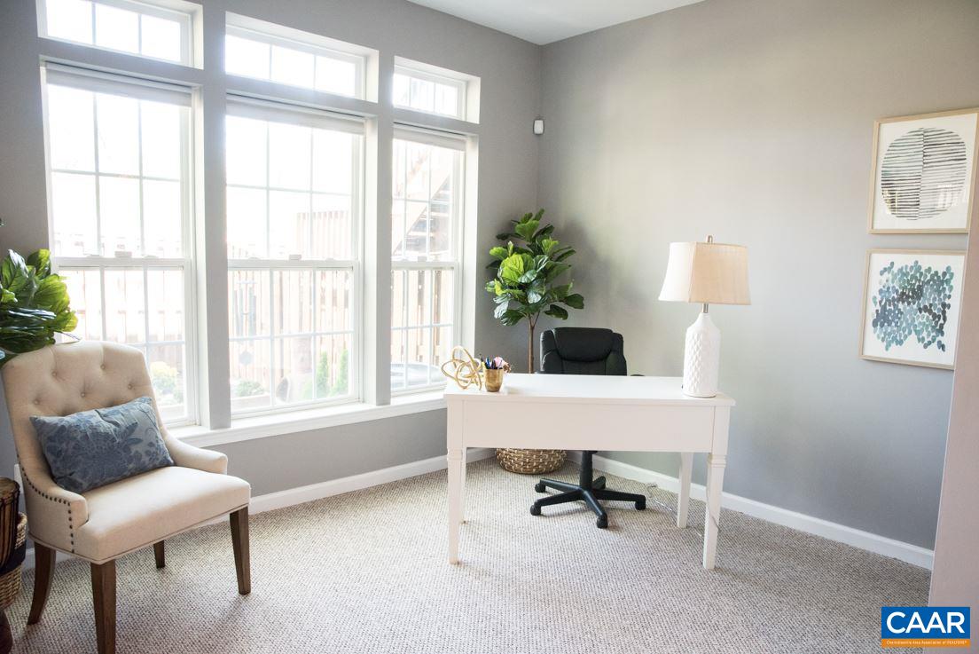 825 Rainier Road Charlottesville, VA 22903 - Photo 7 of 25 a workspace with a couch and a window