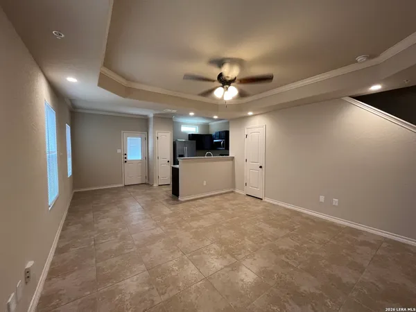 a view of a livingroom with a kitchen