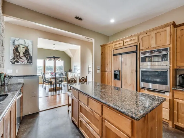 a kitchen with counter top space and stainless steel appliances
