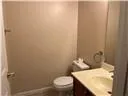 a view of a walk in closet and bathroom