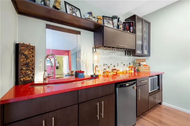 a kitchen with stainless steel appliances a sink and a stove