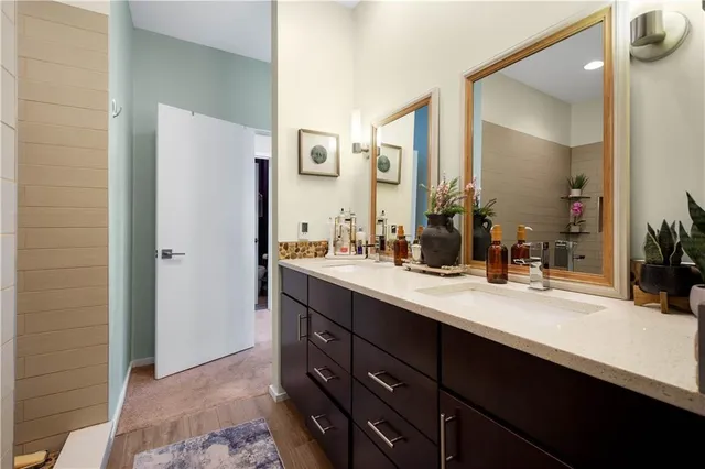 a bathroom with a double vanity sink mirror and double