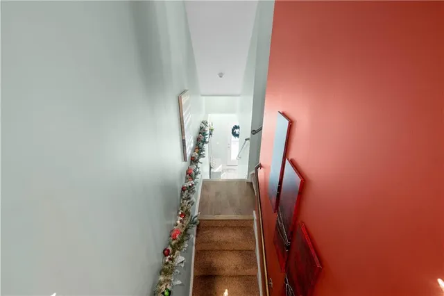 a bathroom with a sink a toilet a mirror and shower