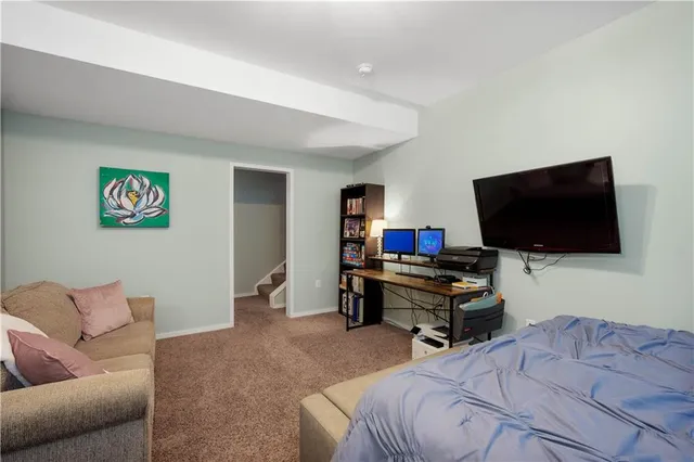 an aerial view of a house with a yard and balcony