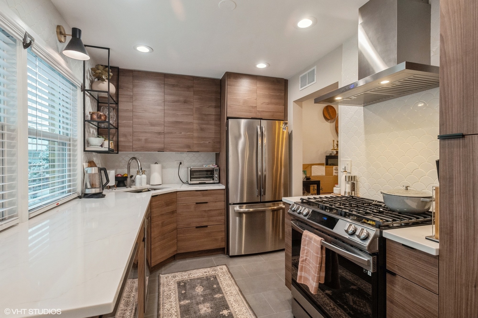 208 South Boulevard, Unit D Evanston, IL 60202 - Photo 6 of 15 a kitchen with stainless steel appliances granite countertop a stove refrigerator and microwave