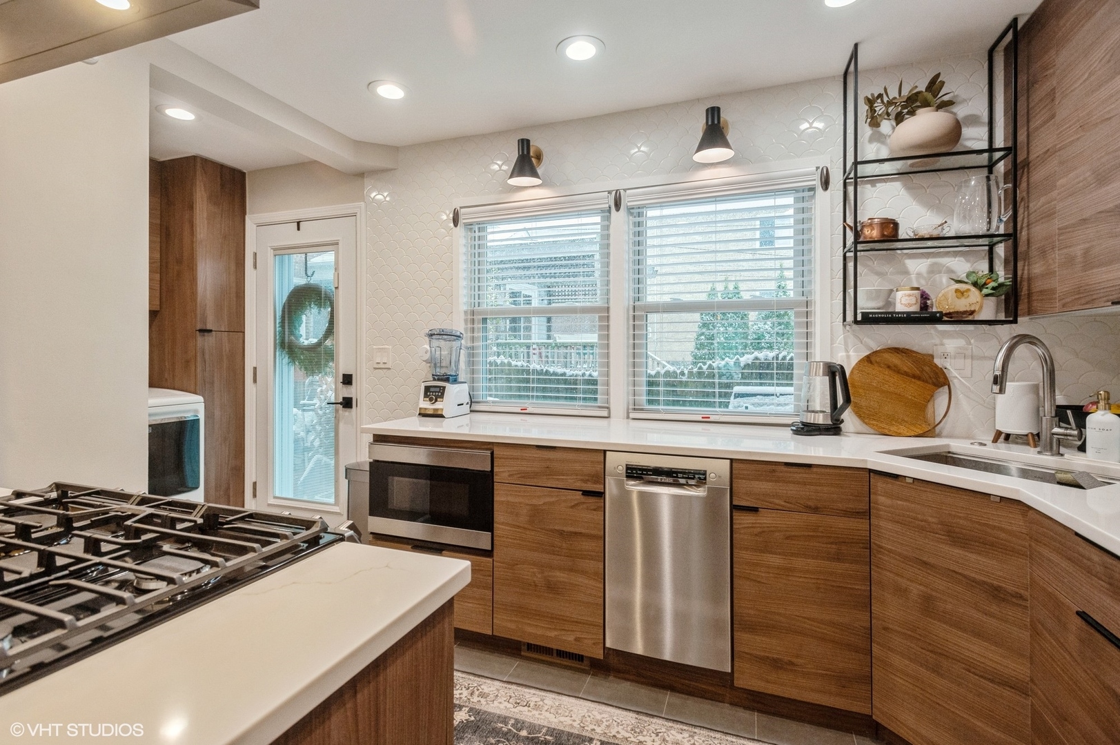 208 South Boulevard, Unit D Evanston, IL 60202 - Photo 7 of 15 a kitchen with stainless steel appliances granite countertop a stove and a sink