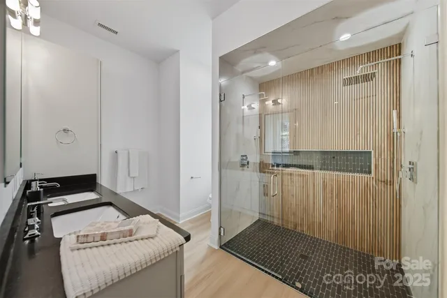 a bedroom with a bed and a shower