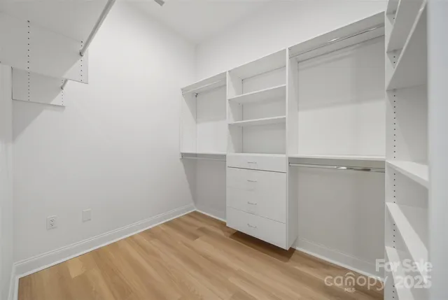 a view of an empty walk in closet