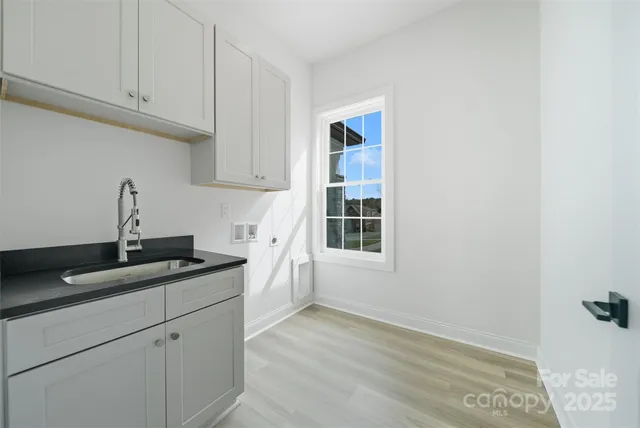 a kitchen with a sink and cabinets
