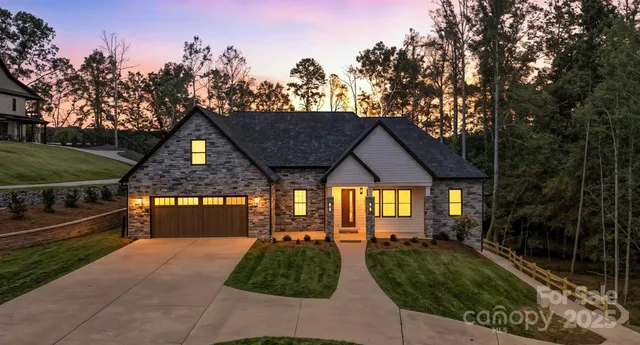 a front view of house along with green space
