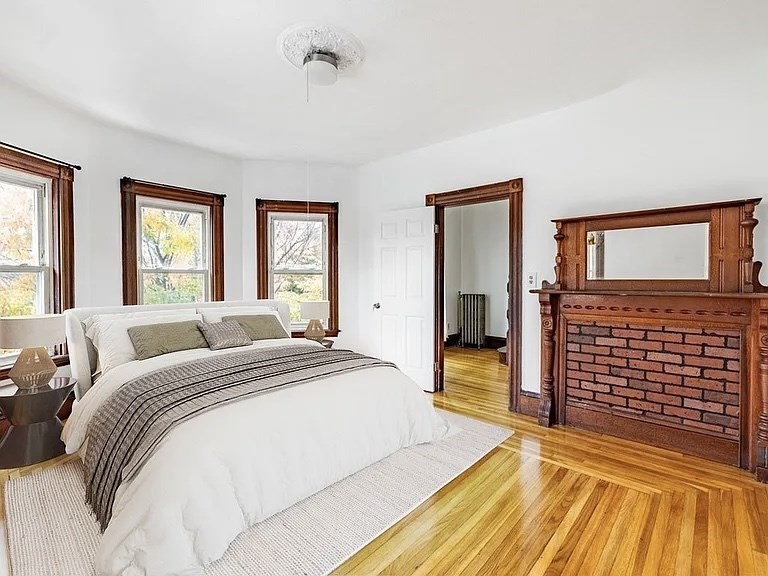 59-61 Glenwood Road, Unit 59 Somerville, MA 02145 - Photo 2 of 31 a bedroom with a bed and a walk in closet
