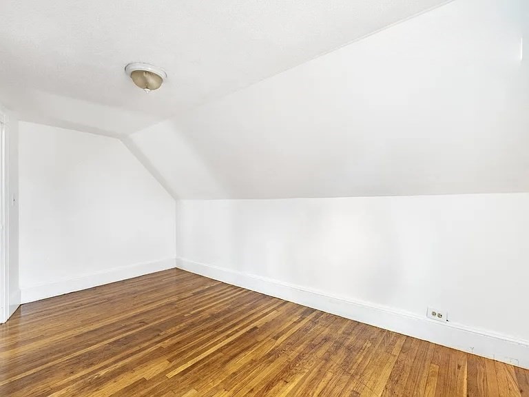 59-61 Glenwood Road, Unit 59 Somerville, MA 02145 - Photo 23 of 31 a view of a room with wooden floor