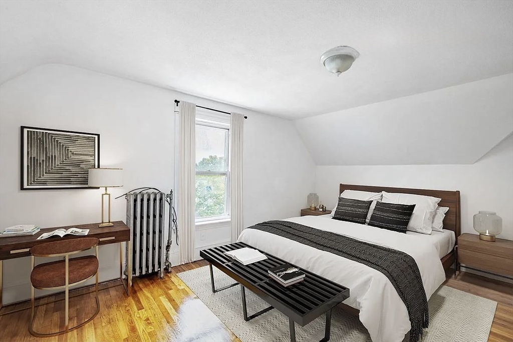 59-61 Glenwood Road, Unit 59 Somerville, MA 02145 - Photo 24 of 31 a bedroom with a bed and a window