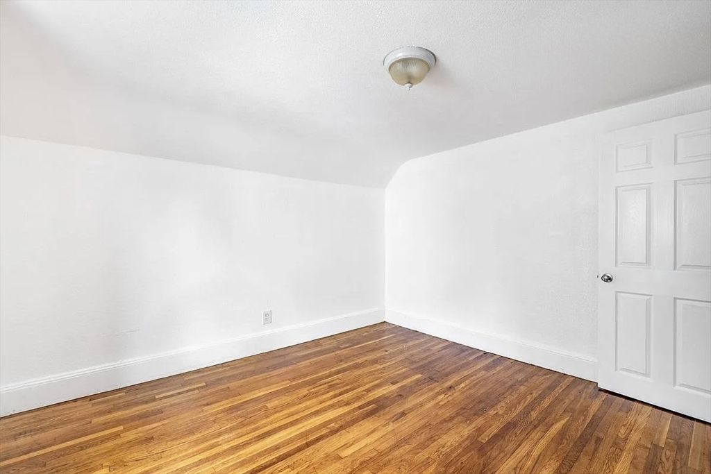59-61 Glenwood Road, Unit 59 Somerville, MA 02145 - Photo 27 of 31 a view of empty room with wooden floor