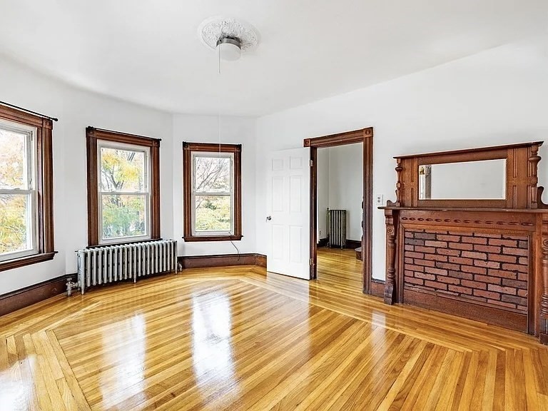 59-61 Glenwood Road, Unit 59 Somerville, MA 02145 - Photo 3 of 31 a view of empty room with wooden floor and fan
