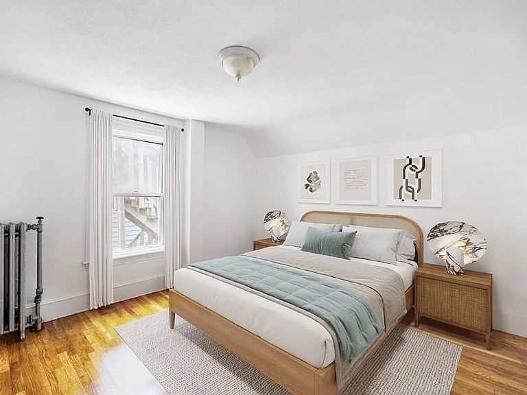 59-61 Glenwood Road, Unit 59 Somerville, MA 02145 - Photo 10 of 31 a bedroom with a bed and a couch