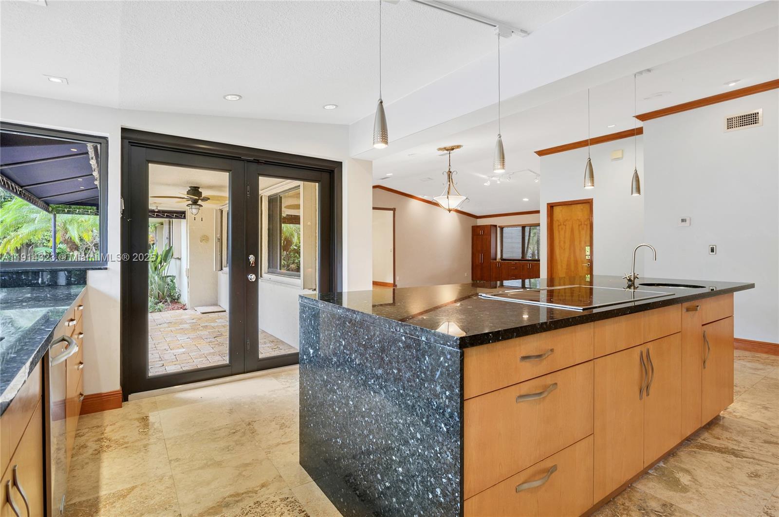 8035 Southwest 89th Court Miami, FL 33173 - Photo 12 of 31 a kitchen with granite countertop a sink and a refrigerator