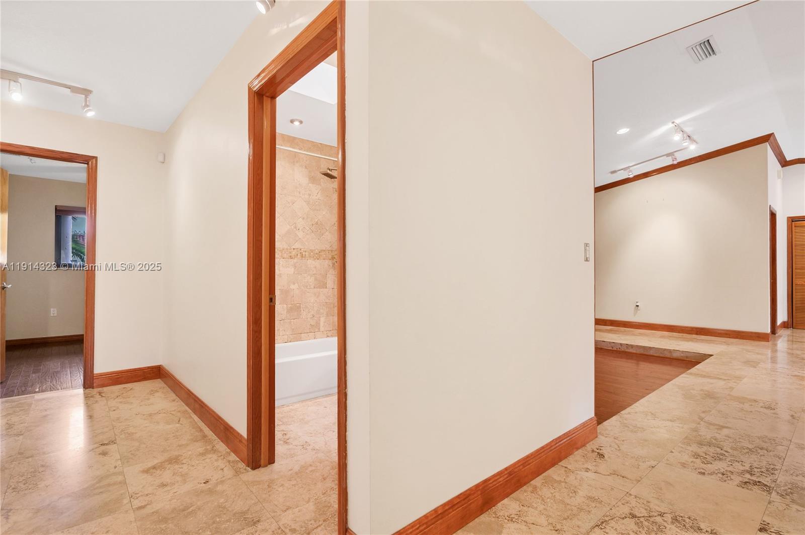 8035 Southwest 89th Court Miami, FL 33173 - Photo 18 of 31 a view of a hallway with wooden floor