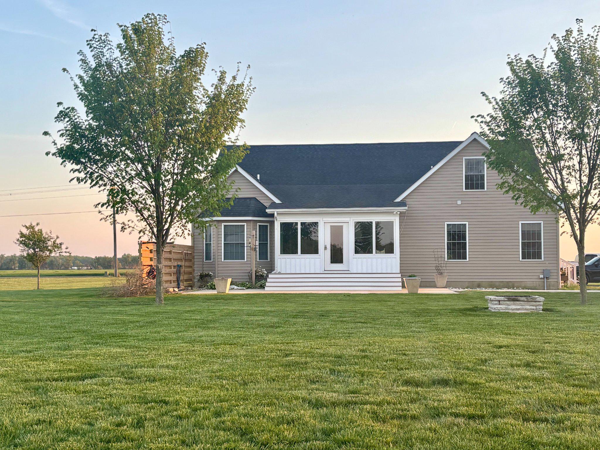 615 Ell Downes Road Henderson, MD 21640 - Photo 4 of 5 Charming home with lush green surroundings.