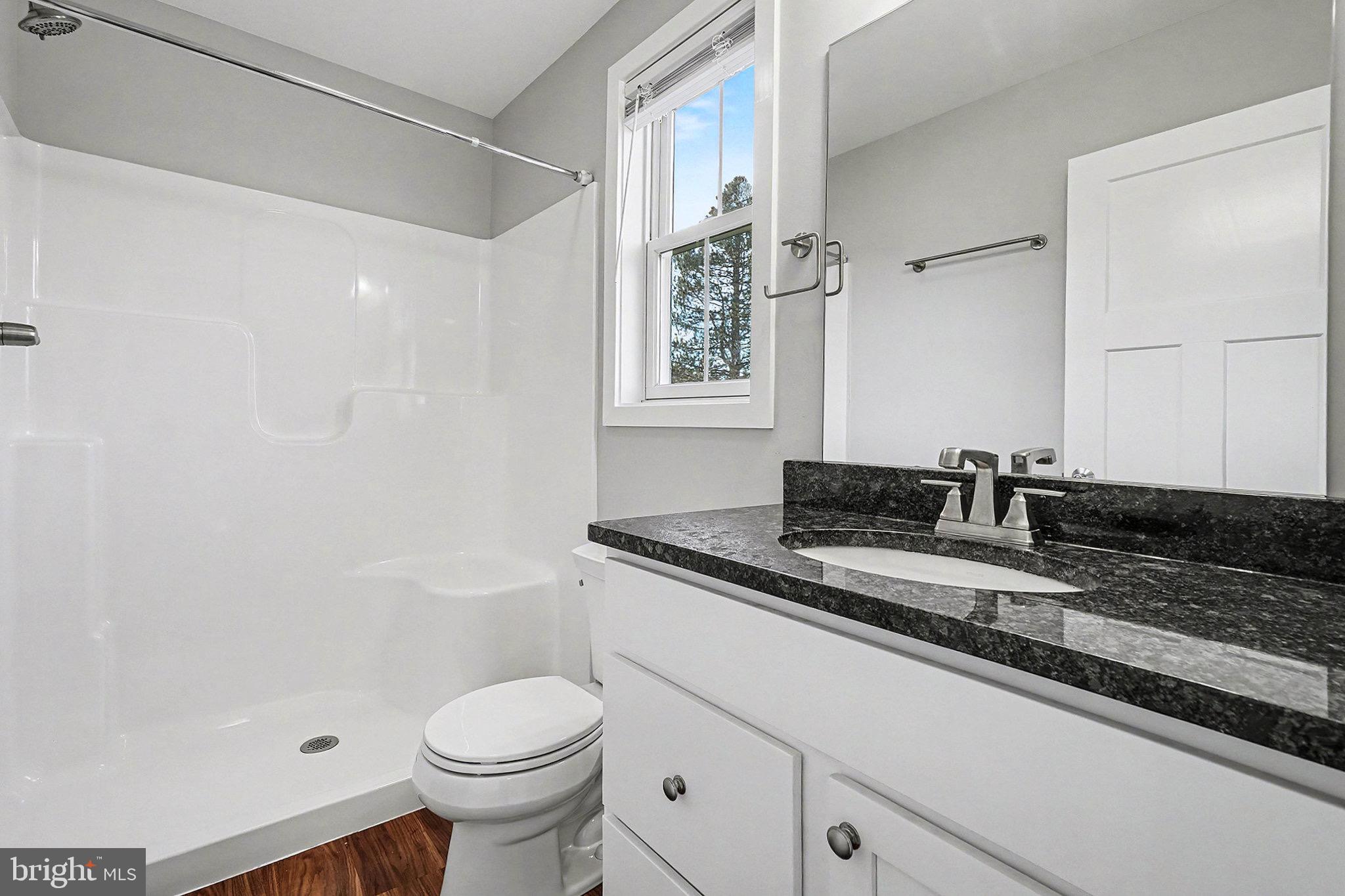 120 Hart Hershey, PA 17033 - Photo 8 of 16 a white toilet sitting next to a bathroom sink