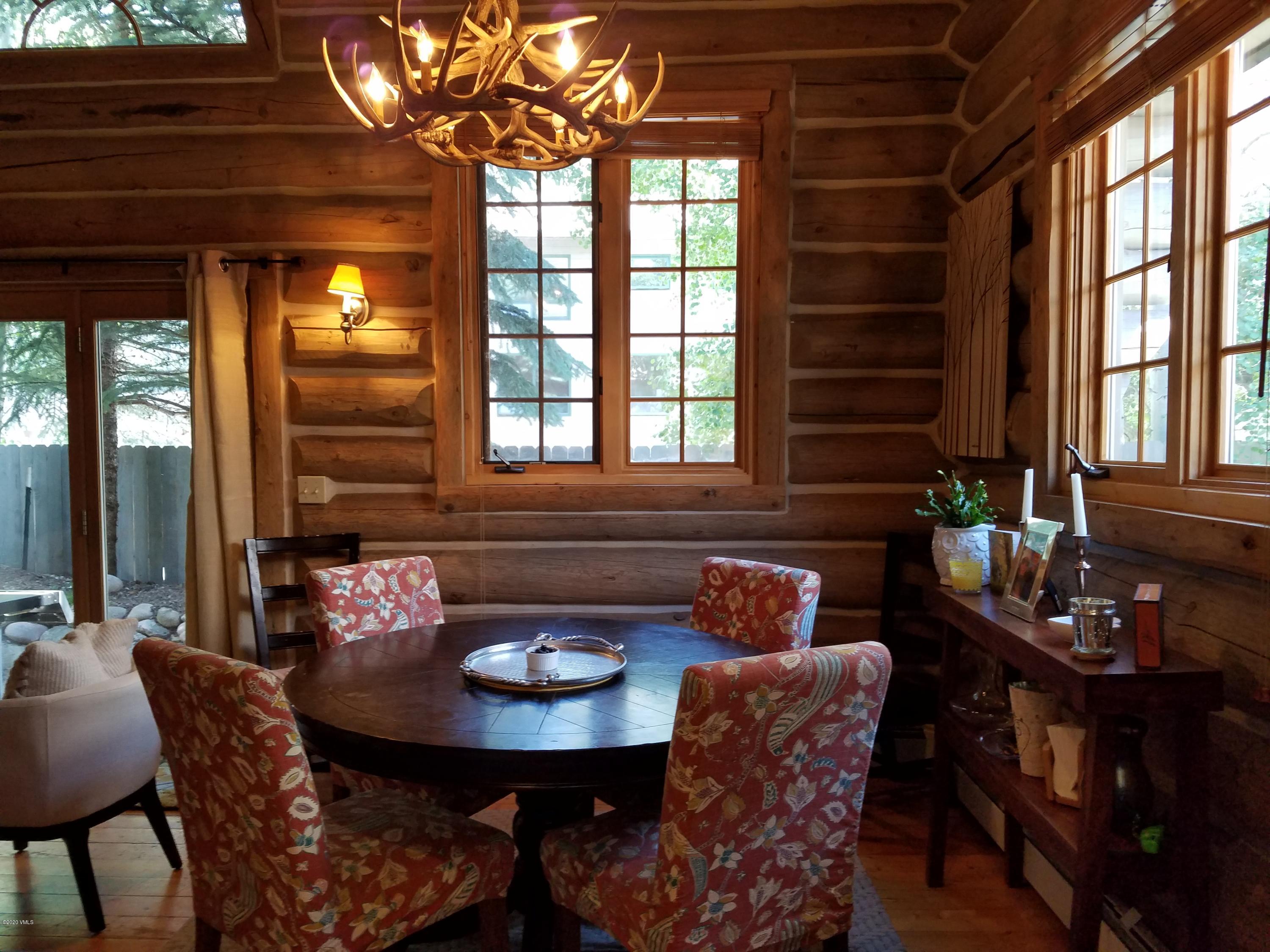 a outdoor dining space with furniture and window
