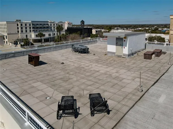 a view of a chairs and table on the terrace