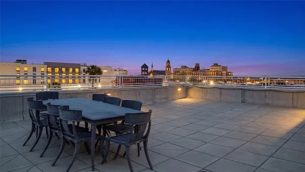 a view of a pool from a balcony