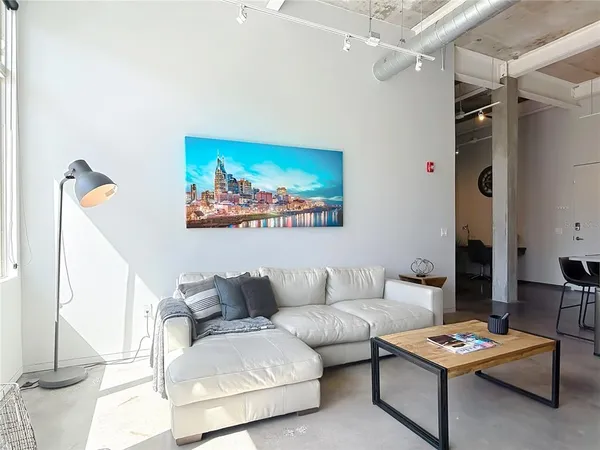 a living room with furniture and a table