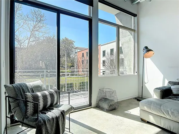 a living room with furniture and a large window
