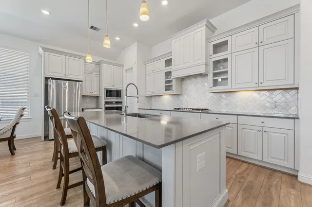 a bedroom with a bed and a ceiling fan