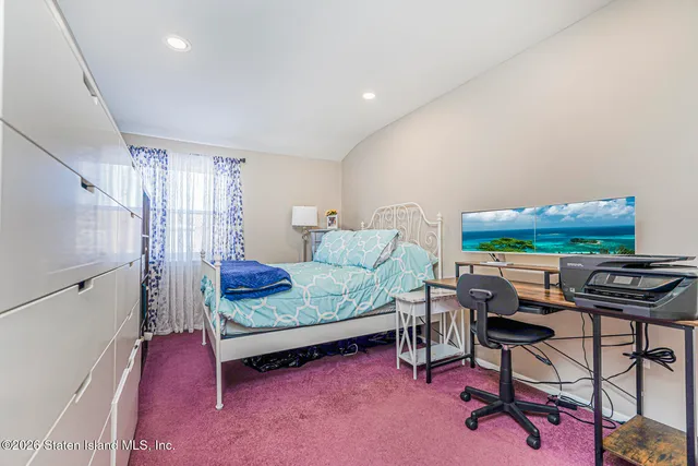 a bedroom with furniture and a window