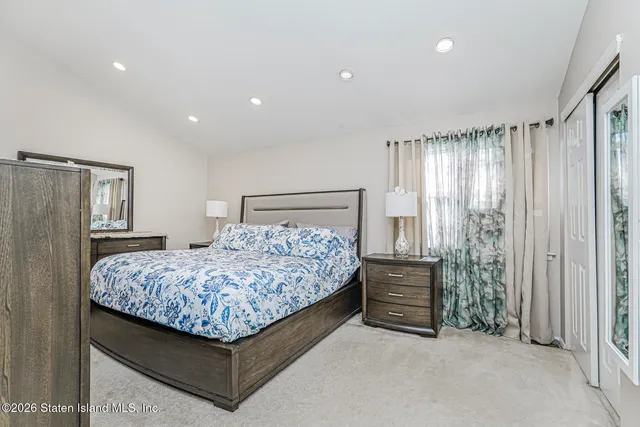 a bedroom with a bed and a cabinets