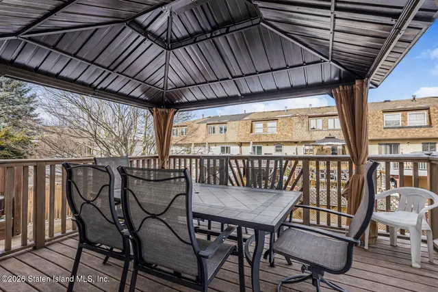 a view of a balcony with furniture