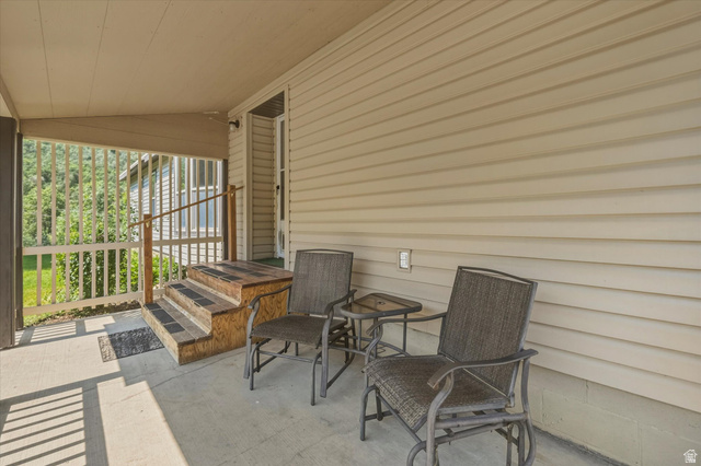2405 Canyon Road Smithfield, UT 84335 - Photo 28 of 57 Covered concrete porch featuring a vinyl siding exterior