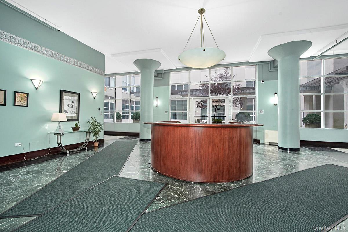 1 Landmark Square, Unit 109 Port Chester, NY 10573 - Photo 4 of 24 a room with pool table and windows