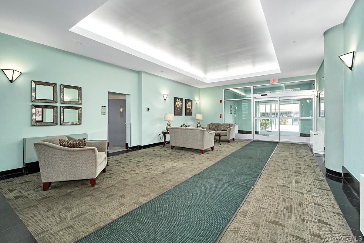 1 Landmark Square, Unit 109 Port Chester, NY 10573 - Photo 5 of 24 a living room with fireplace furniture and a rug