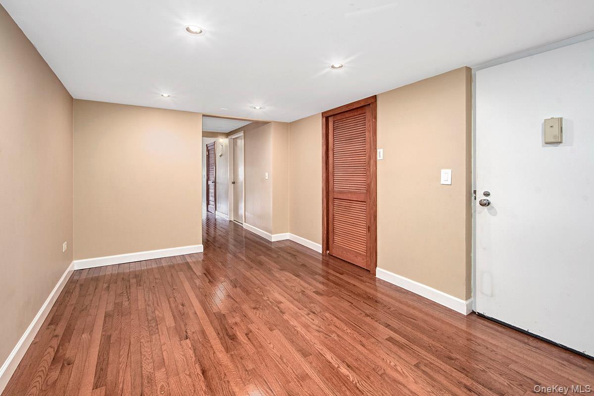 1 Landmark Square, Unit 109 Port Chester, NY 10573 - Photo 9 of 24 wooden floor in an empty room with a window